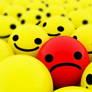 Sad Smiley Among Happy Smilies