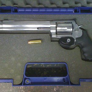 Smith & Wessons Model 500 in case with a .500 Magnum round for comparison