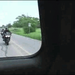 Biker hits the car back.