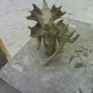 this is the second time I worked on my clay thingy :D
its flashy because some one was bashing on the table ><