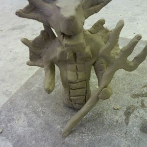 this is the second time I worked on my clay thingy :D
its flashy because some one was bashing on the table ><