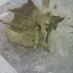 this is the second time I worked on my clay thingy :D
its flashy because some one was bashing on the table ><