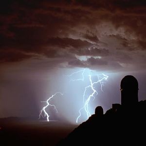 lightning kpno

The observatory is on top of a mountain... so what's the lightning striking through?