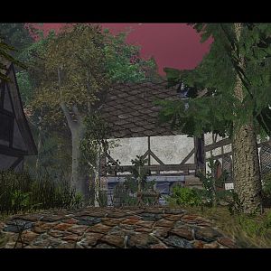 A small village lives in solitude in its natural protection of the trees and mountain ranges that surround it