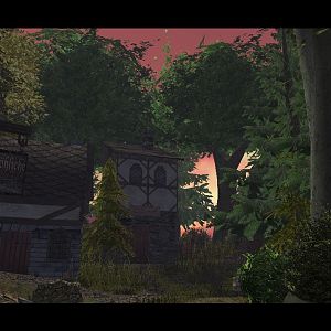As tall trees graze the skies, light floods into the village on an angle traveling under the trees as the sun sets/rises.