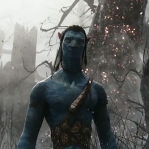 Jake Sully (the main Avatar) among the ruins of the Hometree.