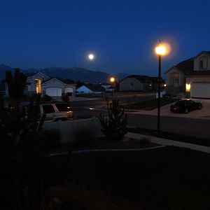 This is where I live Salt Lake City, Utah. The huge mountains and moon always remind me of wolves. Sorry the picture is a bit blurry I took this at 9: