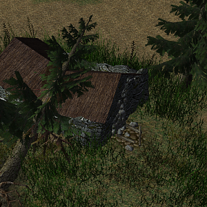 A barn has been crushed by a falling tree