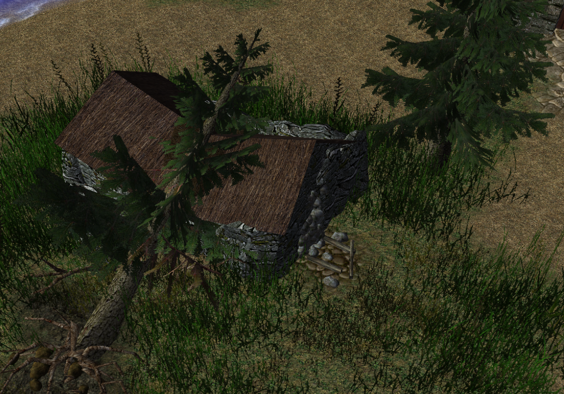 A barn has been crushed by a falling tree