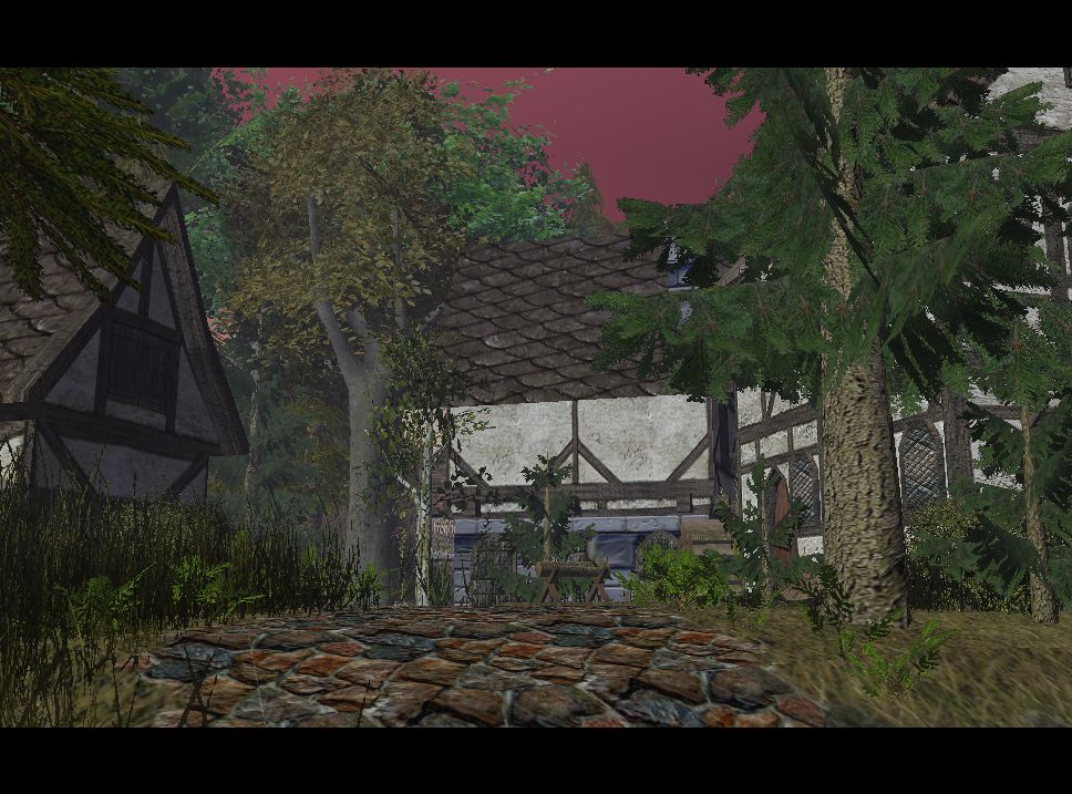 A small village lives in solitude in its natural protection of the trees and mountain ranges that surround it
