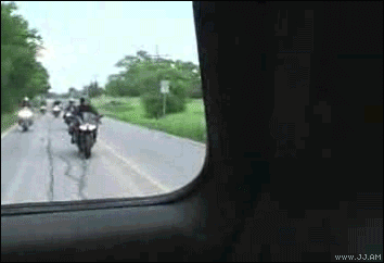 Biker hits the car back.