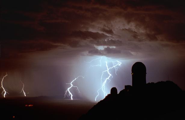lightning kpno

The observatory is on top of a mountain... so what's the lightning striking through?