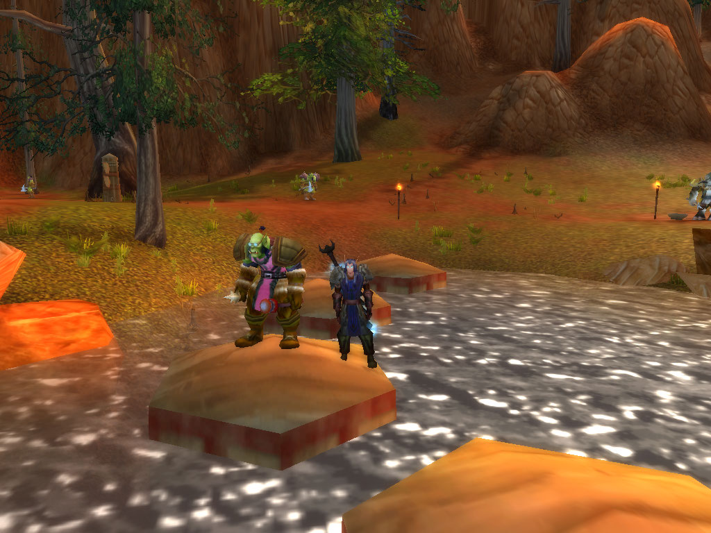 So im standing here about to get wet in the water with my orc friend wearing a PINK tabard...