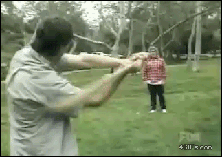 Some dude gets hit by a baseball bat.