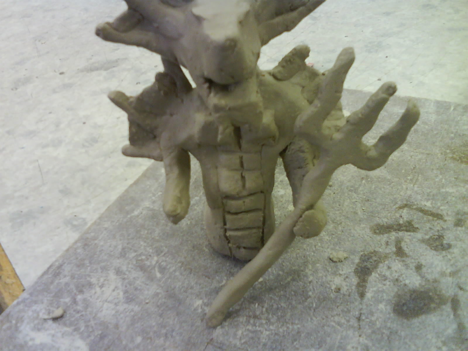 this is the second time I worked on my clay thingy :D
its flashy because some one was bashing on the table ><