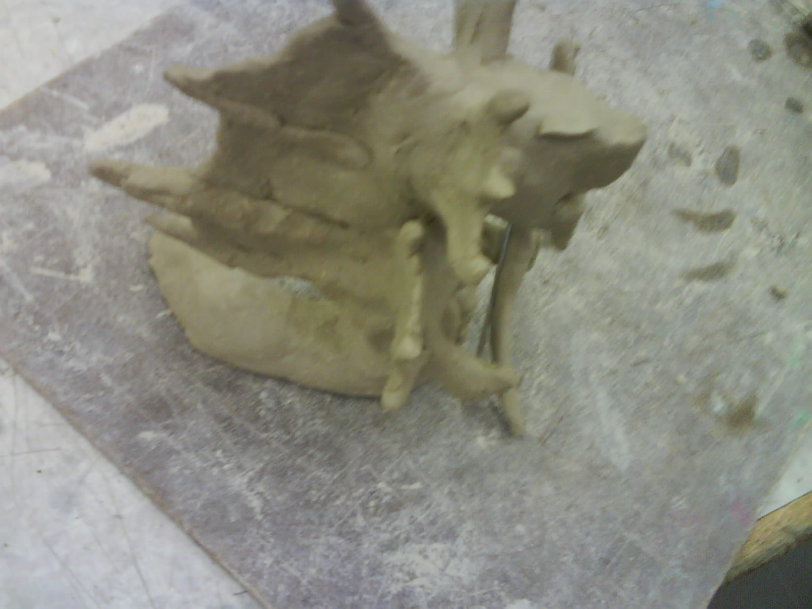 this is the second time I worked on my clay thingy :D
its flashy because some one was bashing on the table ><