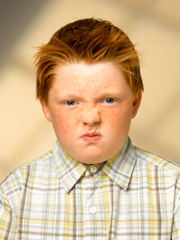 200563694-008-overweight-boy-frowning-portrait-gettyimages.jpg
