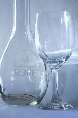 3317769-empty-wine-glass-and-a-bottle-with-light-reflection.jpg