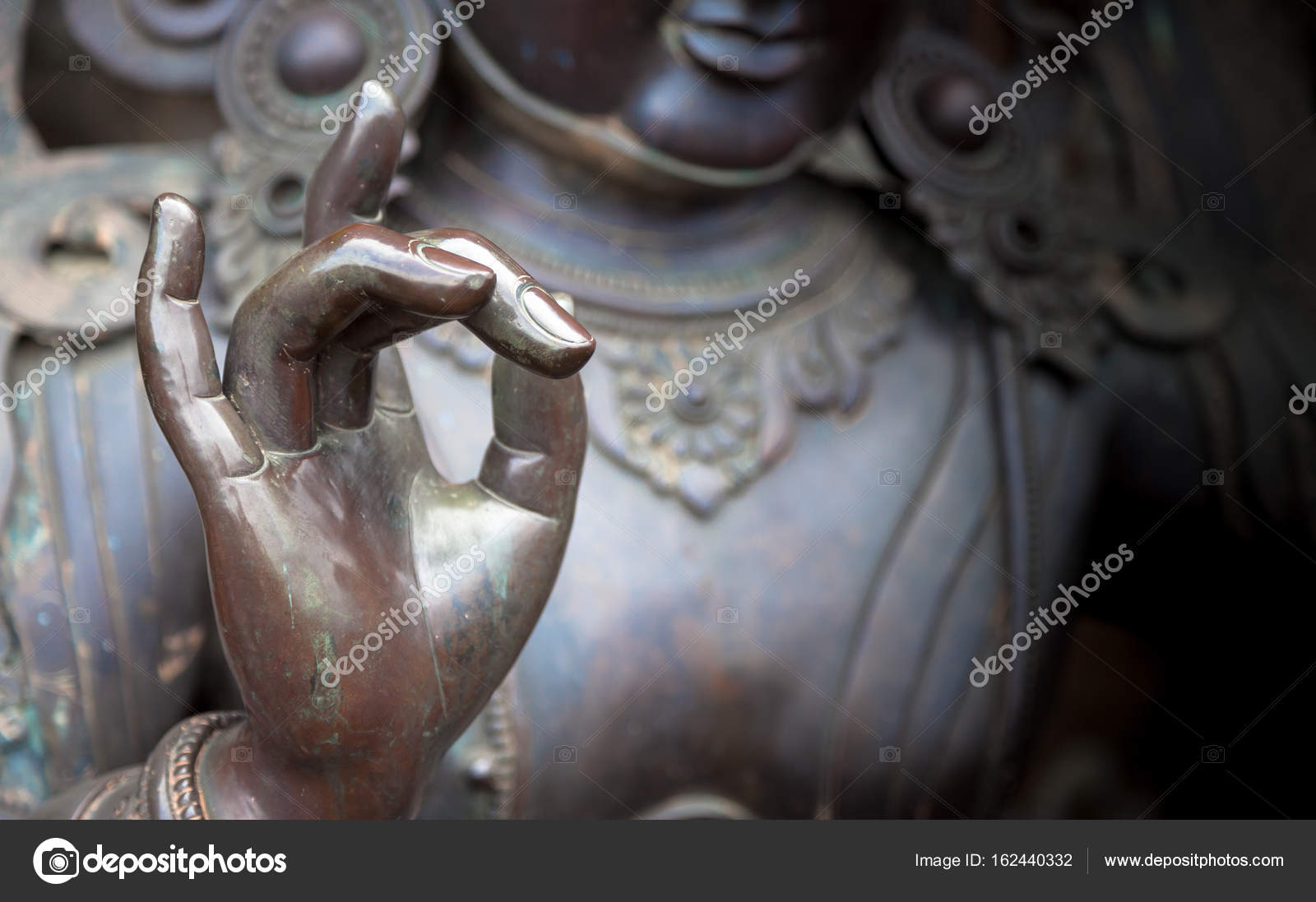 depositphotos_162440332-stock-photo-detail-of-buddha-statue-with.jpg
