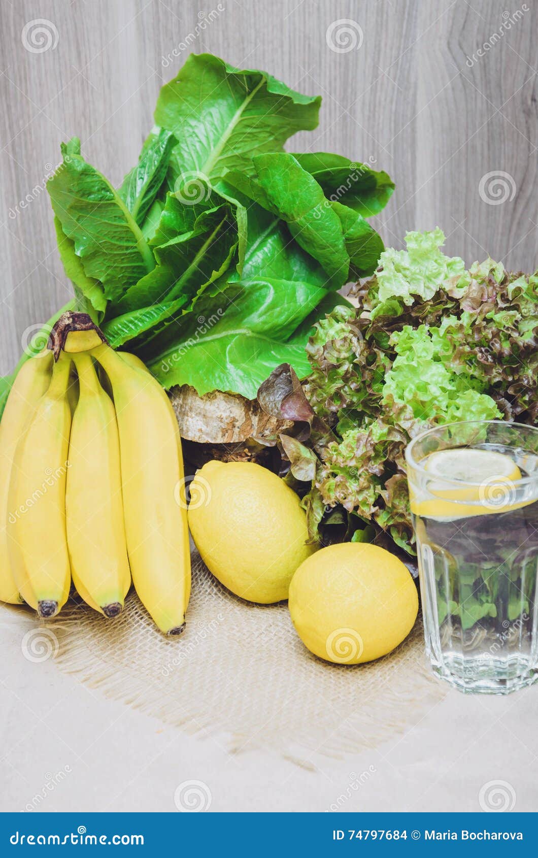 fresh-lemon-water-yellow-lemons-bananas-green-plants-salad-diet-healthy-concept-still-life-home-made-vitamin-74797684.jpg